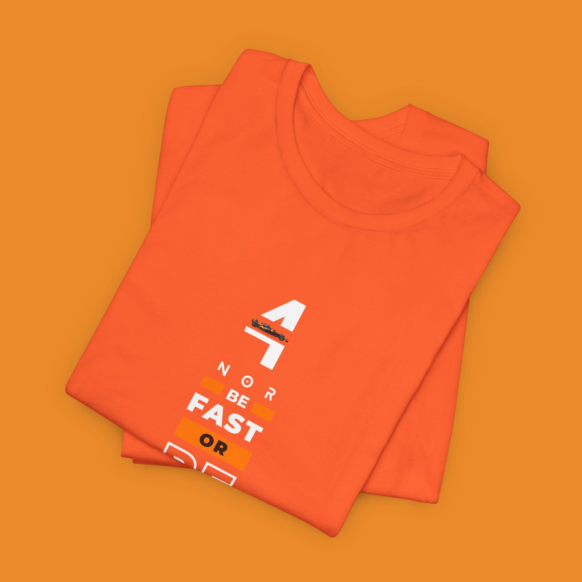 Papaya orange racing-inspired unisex short sleeve tee with a motorsport aesthetic. Perfect for Grand Prix fans and speed enthusiasts.