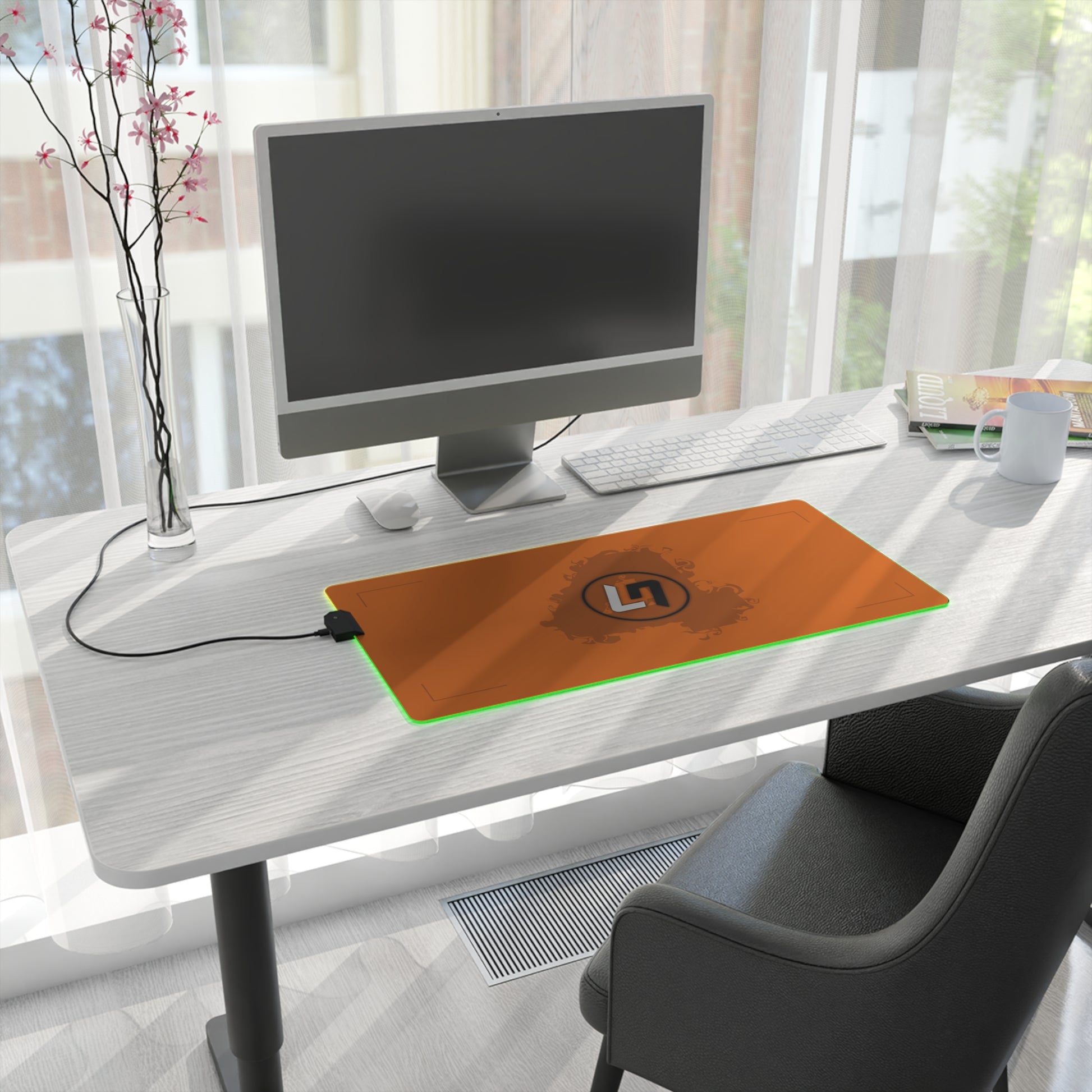 Papaya orange and black racing-inspired mouse pad with a high-performance glide surface. Inspired by young British racing talent.