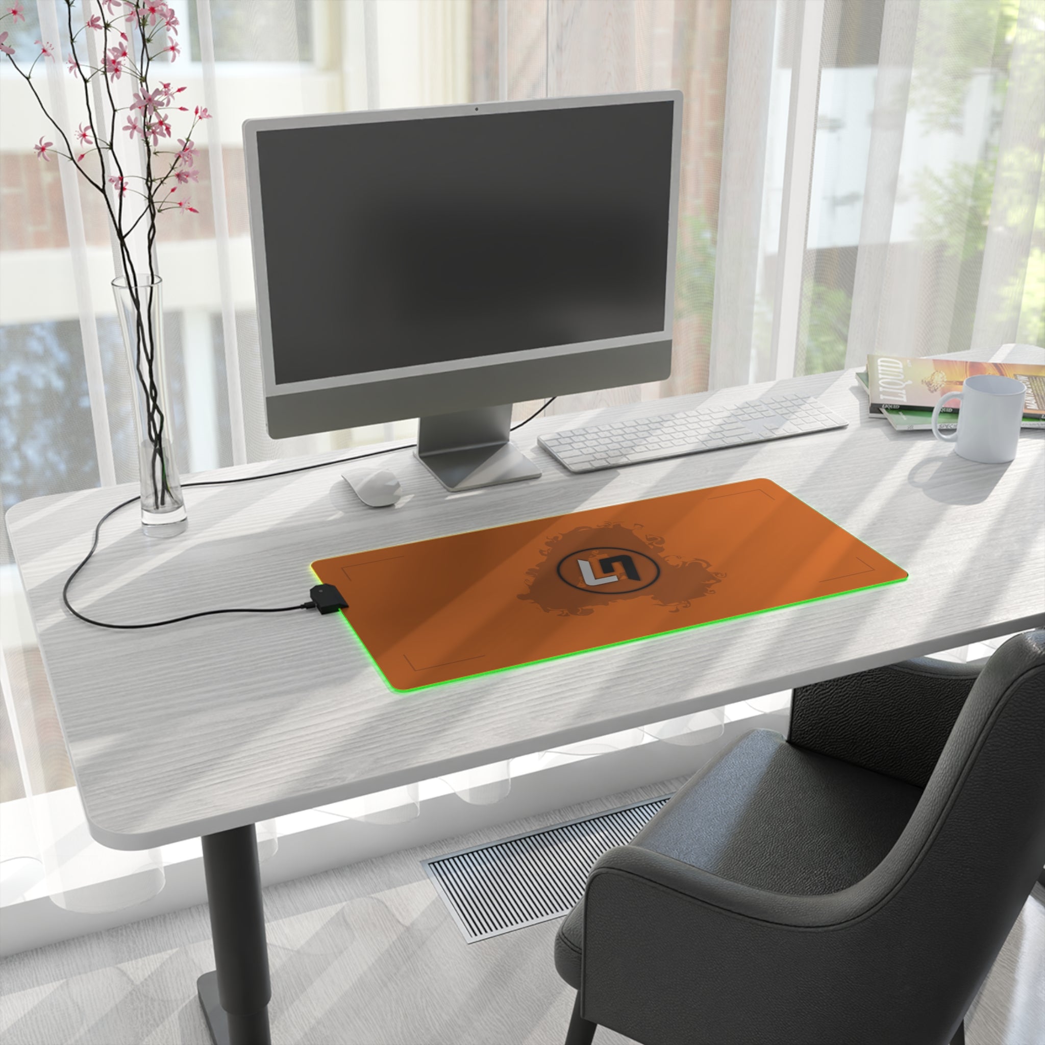 Papaya orange and black racing-inspired mouse pad with a high-performance glide surface. Inspired by young British racing talent.