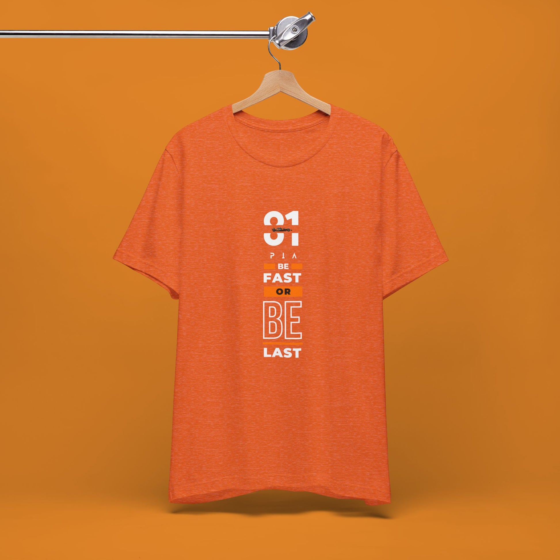 Papaya orange racing-inspired unisex short sleeve tee with a motorsport aesthetic. Perfect for Grand Prix fans and speed enthusiasts.