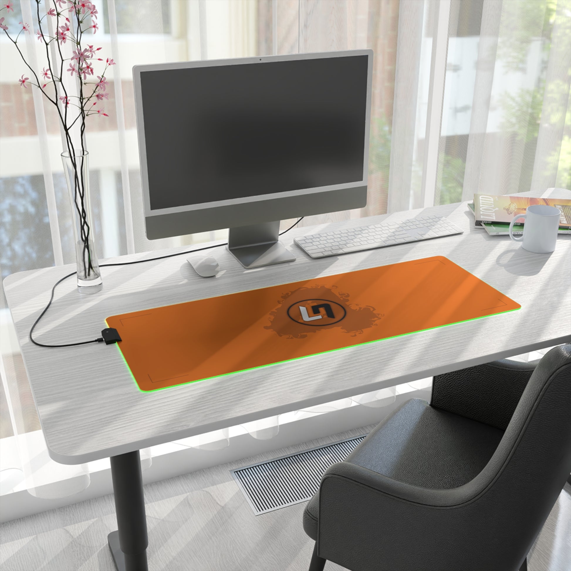 Papaya orange and black racing-inspired mouse pad with a high-performance glide surface. Inspired by young British racing talent.