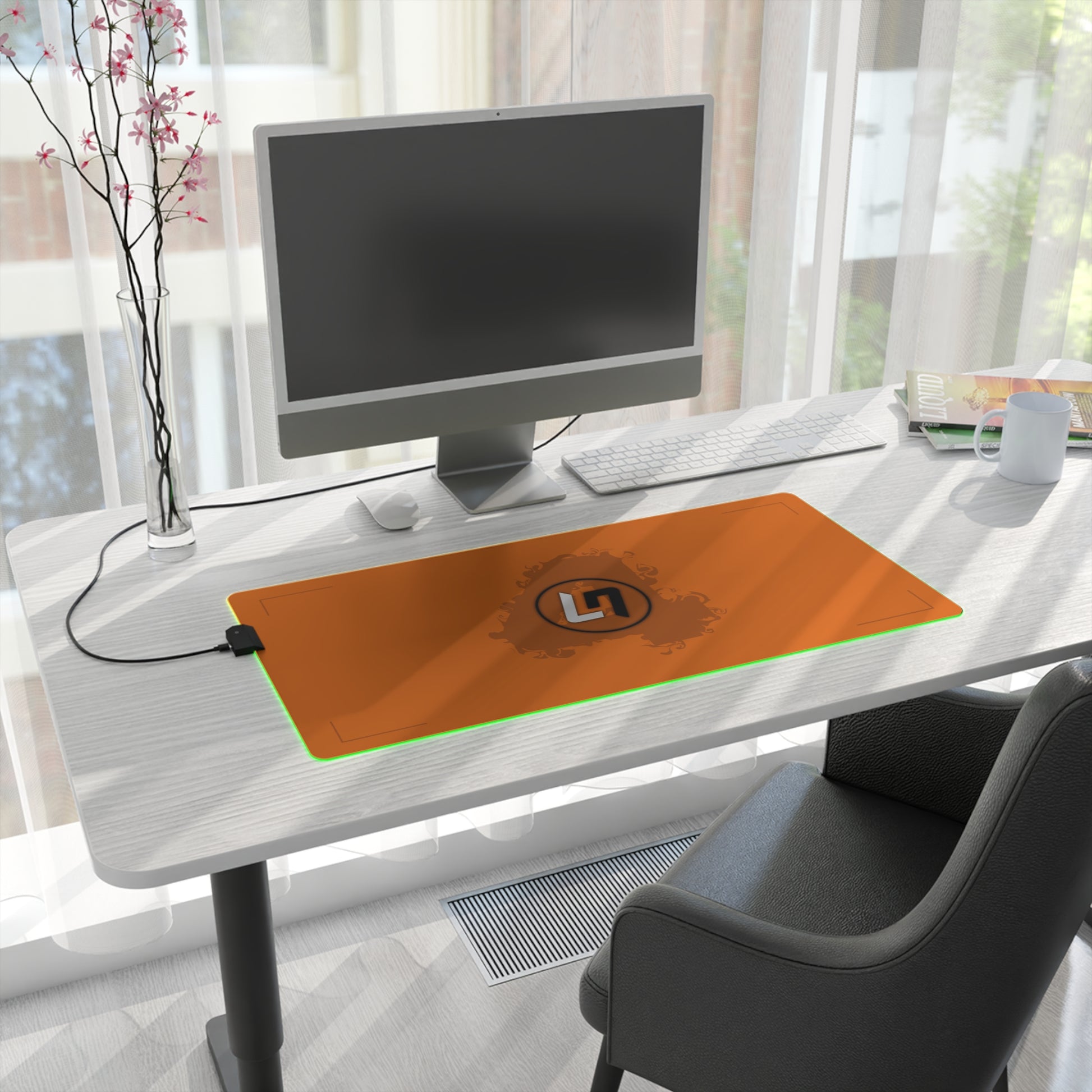Papaya orange and black racing-inspired mouse pad with a high-performance glide surface. Inspired by young British racing talent.
