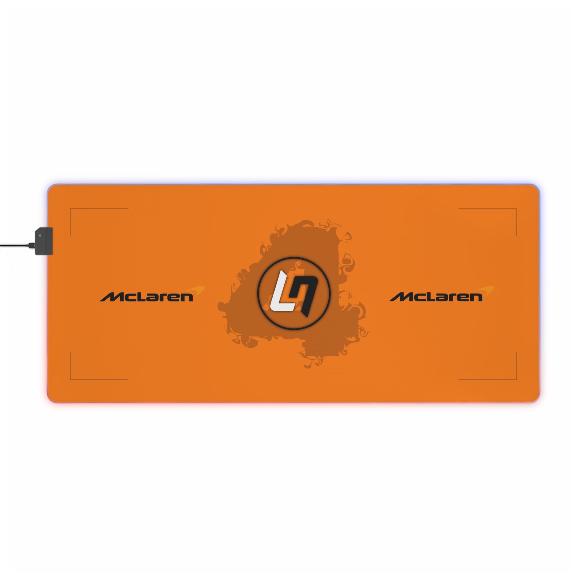Papaya orange and black racing-inspired mouse pad with a high-performance glide surface. Inspired by young British racing talent.